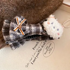 Sweet plaid bow hair clip with a cute plush white bear and brown ribbon decoration