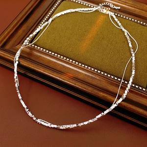 Double-layered silver nugget necklace with square metallic sequins and lobster clasp