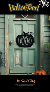 Close-up of black pumpkin Boo sign hanging on a rustic green vintage wooden door