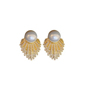Elegant gold fan-shaped leaf earrings with white pearls and sparkling cubic zirconia