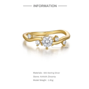 Detail of wave-shaped S925 sterling silver gold plated ring with AAAAA zircon stones