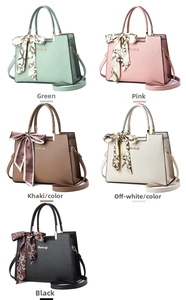 Multiple colors of faux leather handbags with silk scarf handles and gold hardware