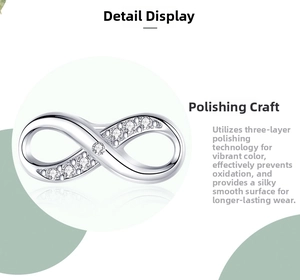 Detail showing infinity silver stud earring with cubic zirconia and polished finish