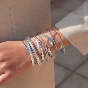 6-piece set of silver-toned irregular geometric twisted open bangles in minimalist style