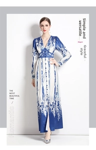 Close-up of royal blue floral print texture and V-neck button detailing on the maxi dress