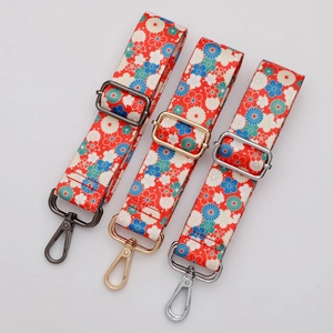 Adjustable woven purse straps with floral Japanese patterns in gold, silver, and gunmetal hooks