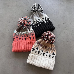 Winter geometric jacquard knit beanies with fluffy pom poms in multiple colors