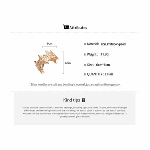 Detailed view of gold sunburst star earrings with white faux pearls and size specs
