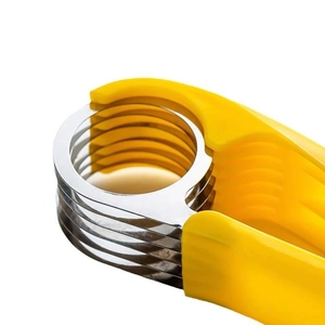 Manual yellow banana slicer with stainless steel blades for kitchen fruit salad prep
