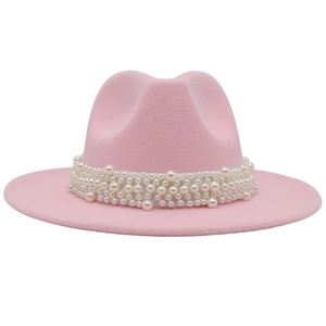 Detail of pink wool fedora hat featuring multi-layer white pearl decorative bands