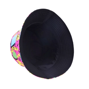 Close-up of bucket hat with pop art geometric patterns and solid black lining detail