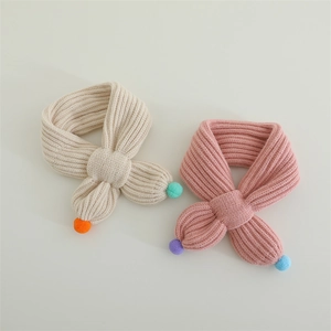 Soft knitted baby winter scarf set with colorful pom-poms for toddlers warmth