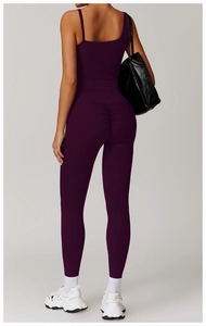 Detail of high waist scrunch butt yoga pants in plum with moisture wicking fabric
