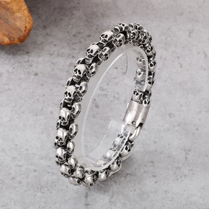 Classic silver-toned stainless steel skull bracelet with punk gothic street style design