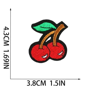 Detail view of red cherry embroidered patch with size dimensions 4.3cm by 3.8cm