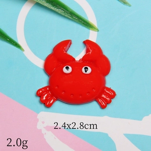 Macro shot of a red crab resin accessory for DIY crafts with 2.4x2.8cm size detail