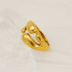 Polished 18K gold stainless steel irregular liquid-style open ring on a neutral tray