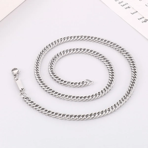 Detailed view of silver titanium steel flat curb chain necklace with square tag and clasp