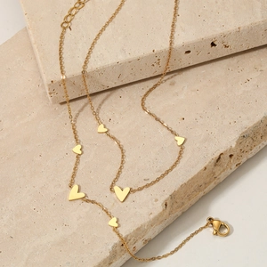 Golden 316 stainless steel necklace with small heart charms on elegant beige stones