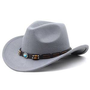 Detail of grey felt cowboy hat featuring leather band with turquoise and wooden beads