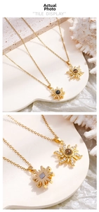 Macro shot of sunburst projection pendant necklace with clear stone and gold metal chain