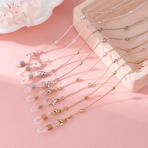 Detail of beaded eyewear chains with lobster clasps and silicone loops in various metal tones