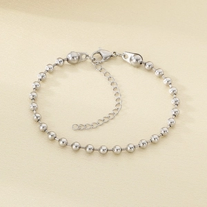 Detail of silver bead chain bracelet with lobster clasp and adjustable extension link