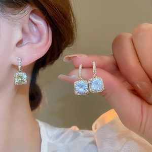 Detailed view of 18k gold plated square zircon earrings with sparkling micro-pave crystals