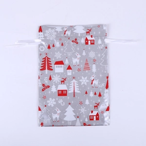Detailed view of Christmas drawstring gift bag with reindeer and snowflake foil prints