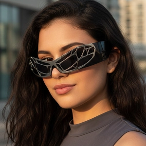 Futuristic silver Y2K wrap-around sunglasses with metallic mesh hollow frame and black lenses