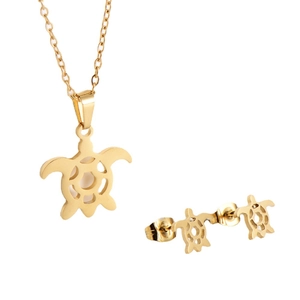 Golden sea turtle jewelry set featuring a necklace and stud earrings with white inlay