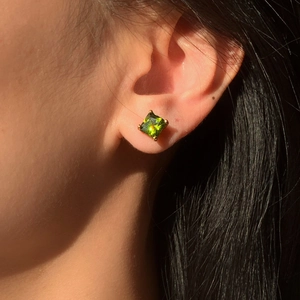 Elegant 18K gold stainless steel earrings with square olive green zircon on ear lobe