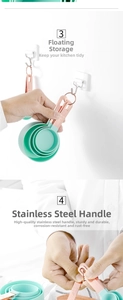 Detail of rose gold stainless steel handles on mint measuring cups with hanging hooks