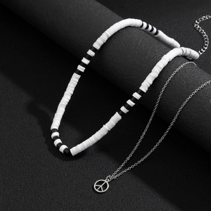Layered peace sign necklace with black and white vinyl beads and silver chain