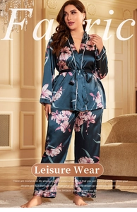 Detail view of plus size navy floral silk pajamas with orchid prints and smooth texture