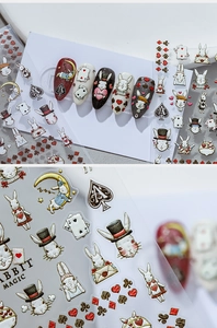 Detailed view of 3D embossed rabbit and playing card nail stickers in vintage storybook style
