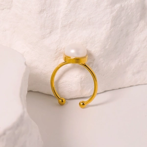 Elegant gold titanium steel ring with white natural freshwater pearl on stone base