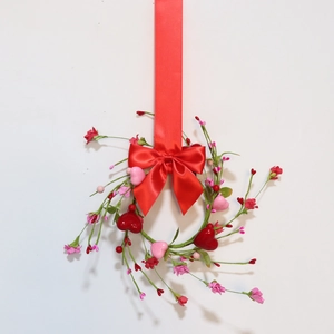 Romantic Valentine heart and berry candle ring with a large red satin bow ornament