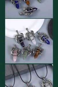 Close-up of silver dragon wrapped hexagonal natural crystal pendants on black cord necklaces