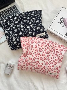 Corduroy leopard print cosmetic bags in black and pink with heart patterns