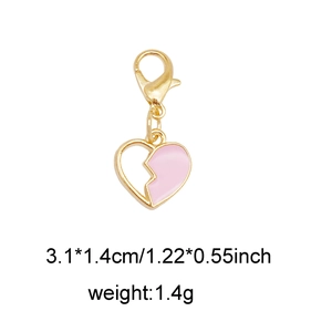 Detail view of pink enamel broken heart charm with lobster clasp and dimension data