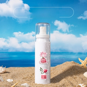 Waterproof heart graffiti stickers on white spray bottle over beach sand background