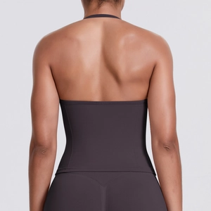 Detail of seamless open-back sports top in charcoal grey showing halter neck design