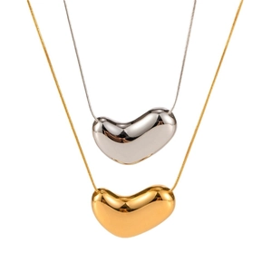 Minimalist 18k gold and silver bean pendant necklaces with sleek snake chains for women
