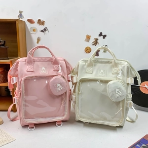Detailansicht der rosa und beigen Ita-Bags mit Sichtfenster und passenden Münztäschchen