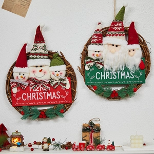 Christmas wreath set with Santa and Snowman dolls on rattan base for holiday door decor