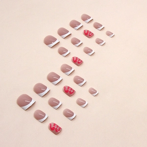 Short French press-on nails with rose red wavy lines and white minimalist curves