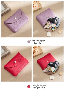 Detail of lychee pattern leather coin pouch in purple and red with snap button closure