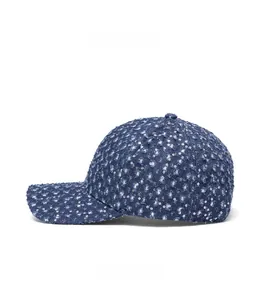 Close-up of distressed denim baseball cap with silver sequins and ripped side details