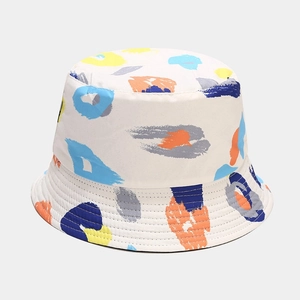 Detail of colorful graffiti lip print bucket hat with durable stitched brim in cream canvas